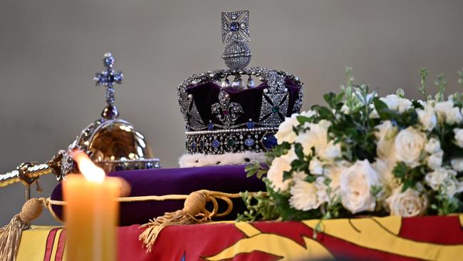 The coffin of Queen Elizabeth II, draped in a Royal Standard and adorned with the Imperial State Crown and the Sovereign's orb and sceptre, inside Westminster Hall. Picture: Marco Bertorello – WPA Pool/Getty Images