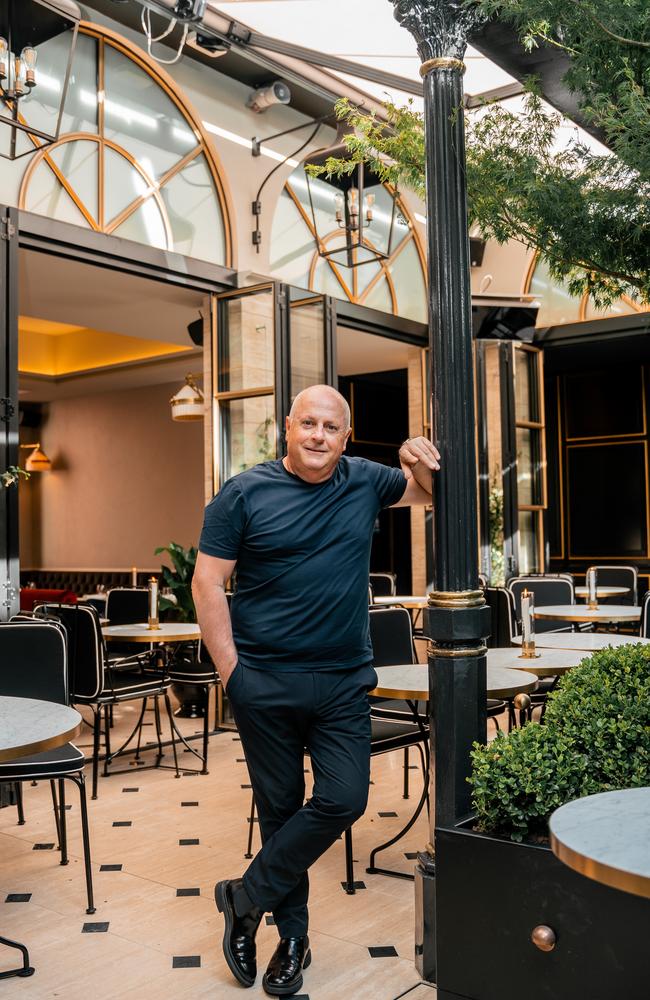 Lucas next to the 50-year-old maple tree that was craned into the restaurant. Picture: Liana Hardy Photography.