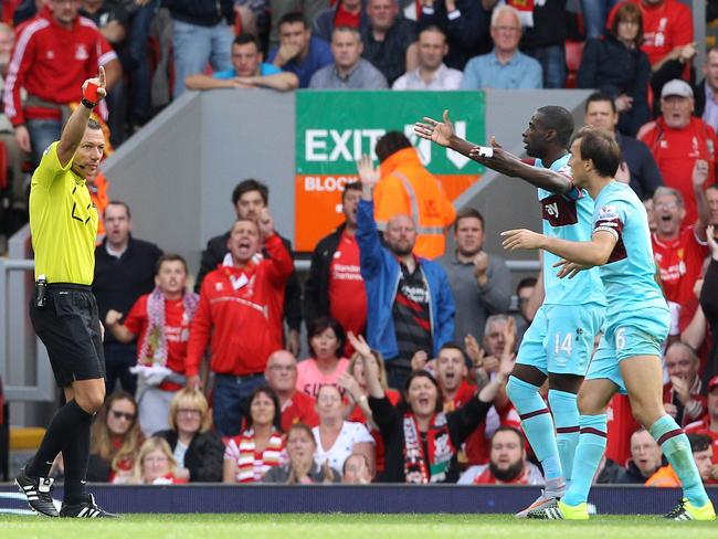 Mark Noble reacts after receiving a red card from referee Kevin Friend.