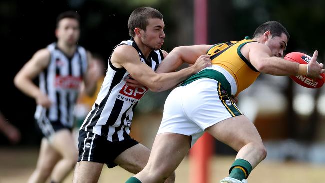 PNU’s James Iannucci tackles Salisbury North’s Anthony Morgante. photo Calum Robertson