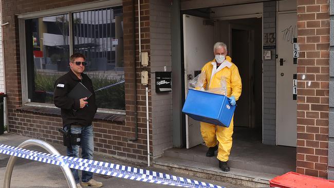 Police working inside a clandestine drug lab in a Melbourne brothel-turned-rehab centre. Picture: Alex Coppel.