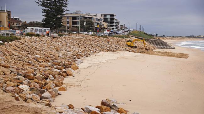 Workers at Cronulla Beach fill the sand area with rocks after huge swells caused massive erosion. Picture: Sam Ruttyn