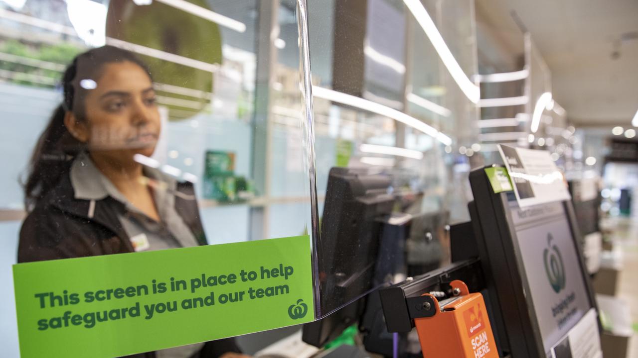 Woolworths has introduced plexiglass screens across its supermarket network to protect workers from being exposed to COVID-19. Picture: Dallas Kilponen