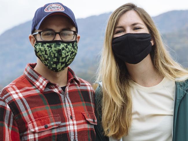 ELECTION FEATURE - CORONAVIRUS -  Jeff Terebey, 31 and Caity Ashley, 25, pose for a portrait in Waynesville, North Carolina, USA. Friday, October 23rd, 2020.