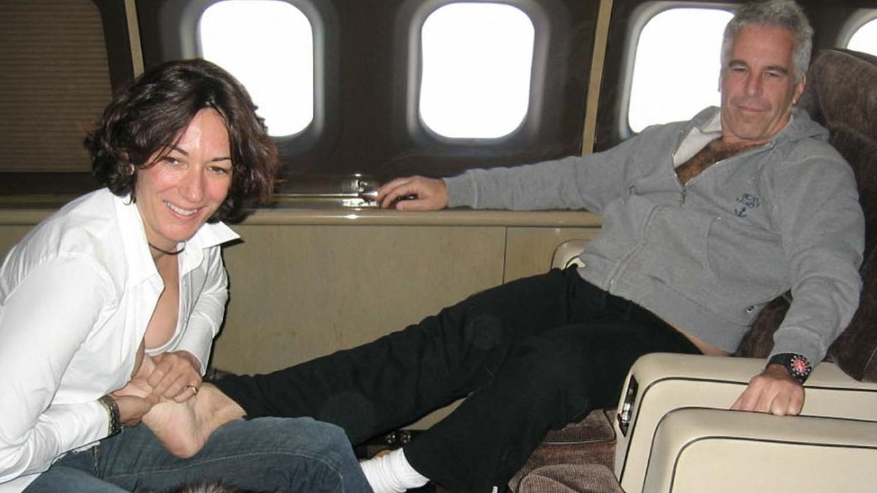 Ghislaine Maxwell and Jeffrey Epstein getting cosy on board his private jet. Picture: AFP