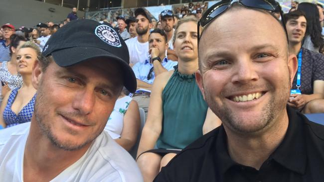 Townsville cryptocurrency investor Michael Sloggett is charged with a string of money laundering offences. Here he is pictured with tennis star Lleyton Hewitt at the Australian Open in 2018.