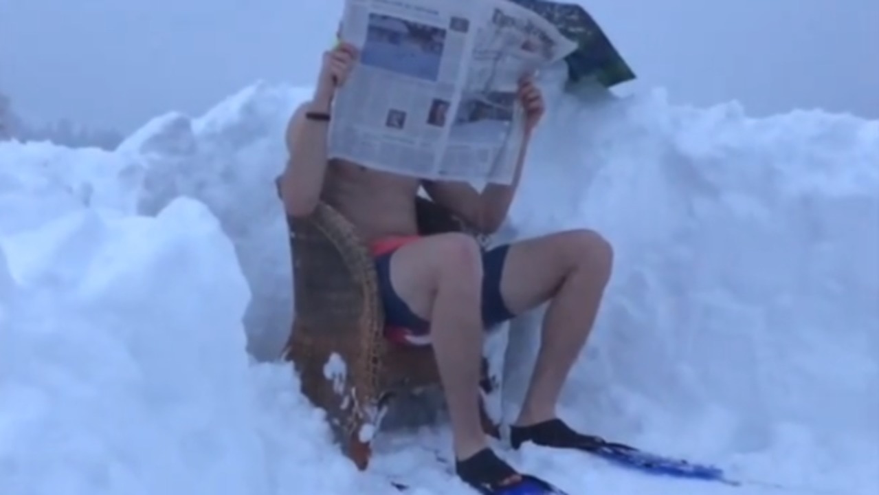 Olympic Skier Dons Swimming Trunks for a Dip in the Fresh Swiss Snow