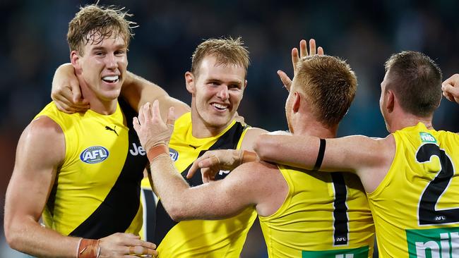 Tom J. Lynch, David Astbury, Nick Vlastuin and Dylan Grimes of the Tigers celebrate