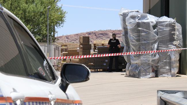 Northern Territory police at the Harvey Norman warehouse on Smith St, Alice Springs, on Tuesday February 4. Picture: Gera Kazakov