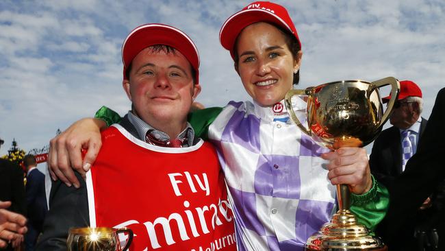 Michelle Payne with brother Stevie after winning the 2015 Melbourne Cup on Prince Of Penzance. Picture: Colleen Petch.