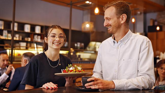 Pablo &amp; Rusty’s co-owner Chris Tate, pictured with staff member Alina Maier, says going cash-free has benefited his customers. Picture: Sam Ruttyn