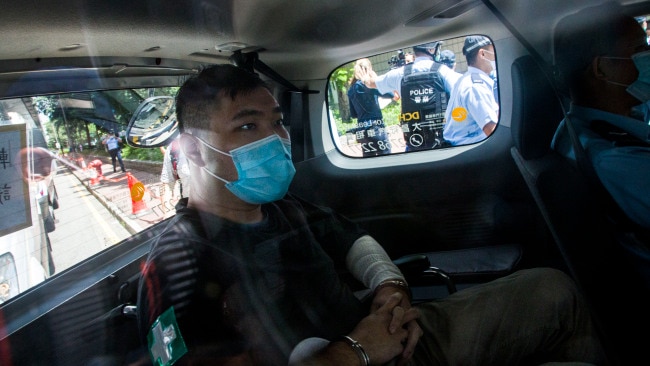 Hong Kong waiter Tong Ying-Kit, 23, arrives at court after being accused of deliberately driving his motorcycle into a group of police officers last Wednesday on July 6, 2020. Picture: Getty