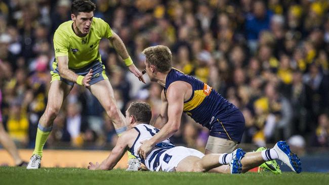 Joel Selwood and Sam Mitchell clash in the first quarter. Picture: AAP