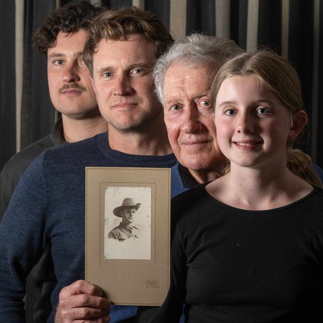 ‘It is absolutely incredible’ … Ross Stansfield-Smith, who provided the DNA that enabled the match, with his family and the new-found photo of Harold. Left-right: Daniel Stansfield-Smith, Chris McDonald, Ross Stansfield-Smith and Ellie McDonald. Picture: Tony Gough