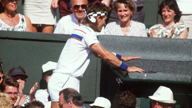 Pat Cash scales the Centre Court architecture after winning Wimbledon in 1987