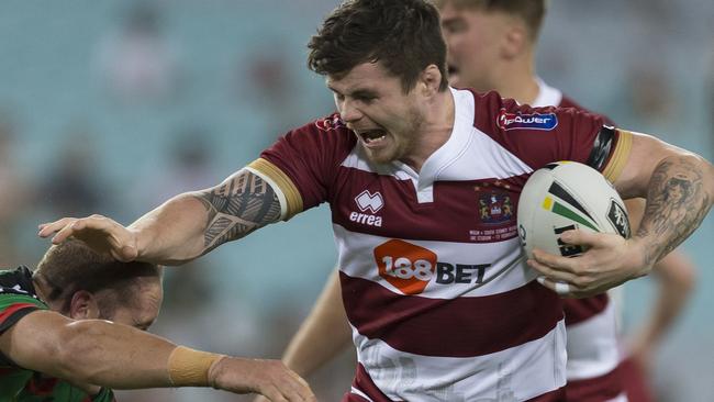 John Bateman taking on the Rabbitohs for Wigan. (AAP Image/Craig Golding)