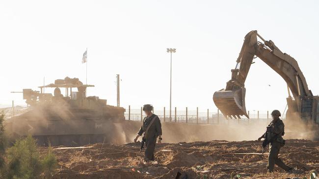 Israeli forces operate with tanks and bulldozers in Gaza.