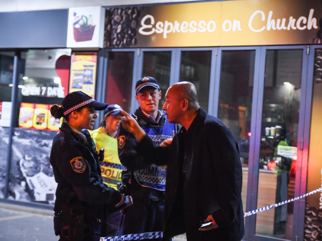 A man argues with police as residents are evacuated. Picture: Flavio Brancaleone