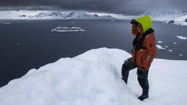 A crew member surveys the scenery.