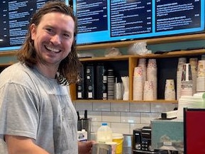 Australian music star, Reuben Styles, has revisited his humble beginnings as a barista after hopping behind the counter at a Townsville cafe to provide a helping hand during the busy flood rush.