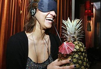 Smashing idea ... a woman enjoys a "blind cocktail" at Zeta Bar in Sydney / Reuters