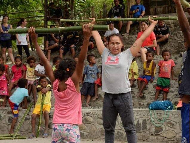 Hidilyn Diaz in Sapang Uwak, Porac, teaching children how to lift weights. Picture: Peacekamp/Facebook