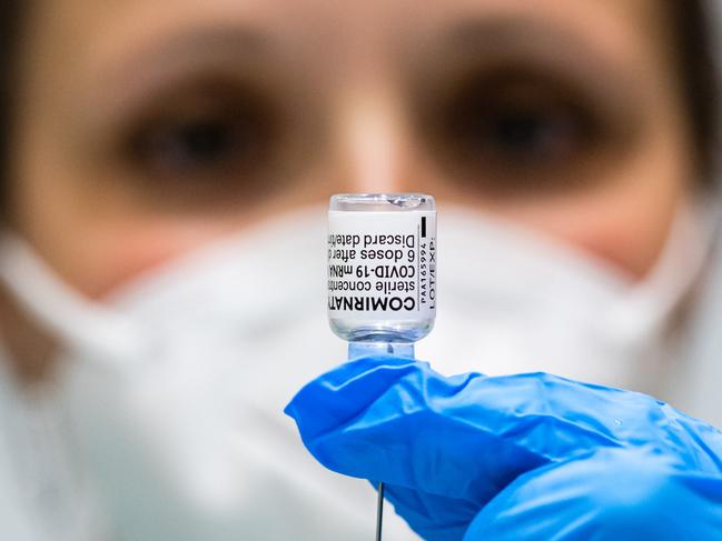 *** BESTPIX *** ERFURT, GERMANY - APRIL 08: Medical Staff prepares a vial of the Pfizer/BioNTech Comirnaty vaccine against Covid-19 at a vaccination center at the Messe trade fair grounds during the third wave of the coronavirus pandemic on April 8, 2021 in Erfurt, Germany. German authorities are expecting a strong increase in the volume of inoculations in April as vaccine supplies stabilize. Germany began vaccinations in late December and authorities predict as many vaccine doses to arrive in April as in the three months before. So far about 13% of people in Germany have received a first dose. (Photo by Jens Schlueter/Getty Images)