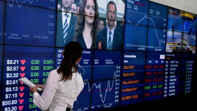 Market trading boards are seen at the Australian Securities Exchange in Sydney, Friday, February 9, 2018. ( AAP Image/Ben Rushton) NO ARCHIVING