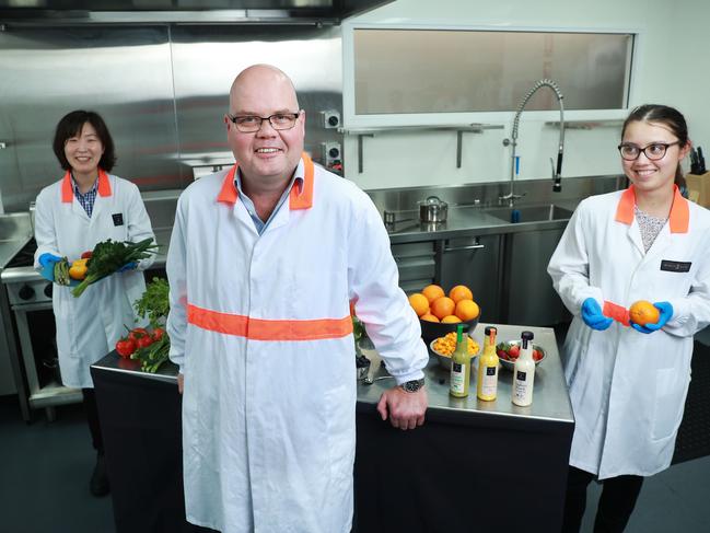 7/10/20: CEO Paul O'Brien with food technologist Sabine Yang. Paul runs a successful food production business that makes sauces, dressings and relishes and recently invested in a state of the art research and development kitchen at his Marrickville site. He says the budget boost to business investment comes at the right time for his business. John Feder/The Australian.