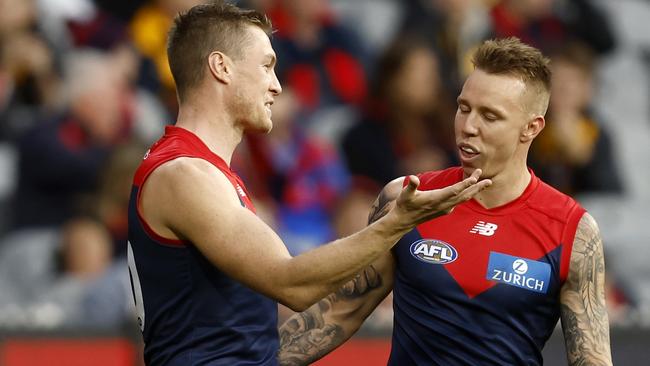 Tom McDonald (left) explains to James Harmes why he marked his kick on the goal-line. Picture: Getty Images