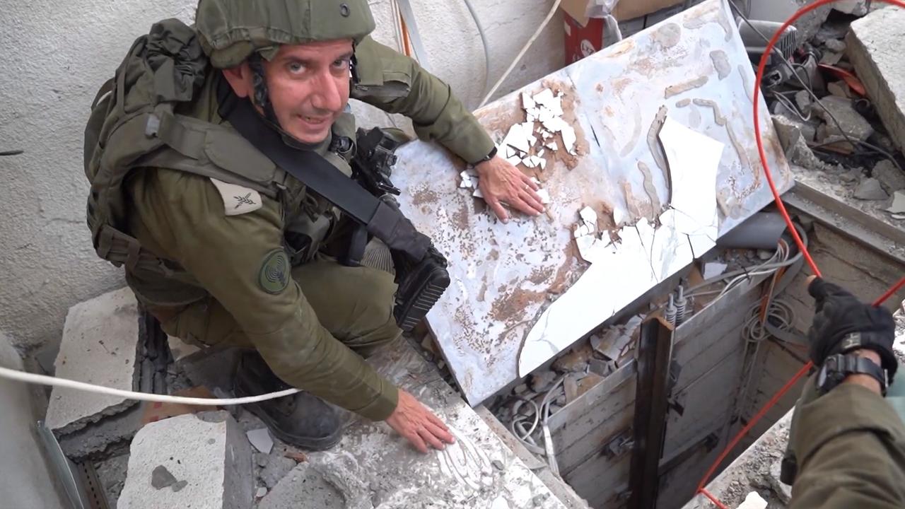 Daniel Hagari at the entrance to a Hamas tunnel.