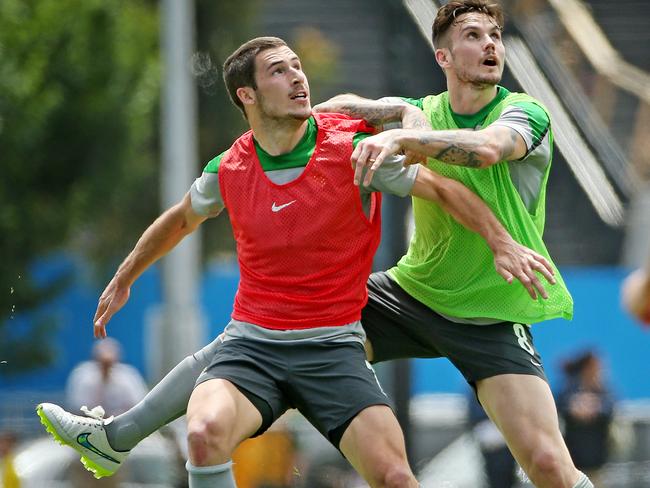 Mathew Leckie tries to get the better of Chris Herd at Socceroos training.