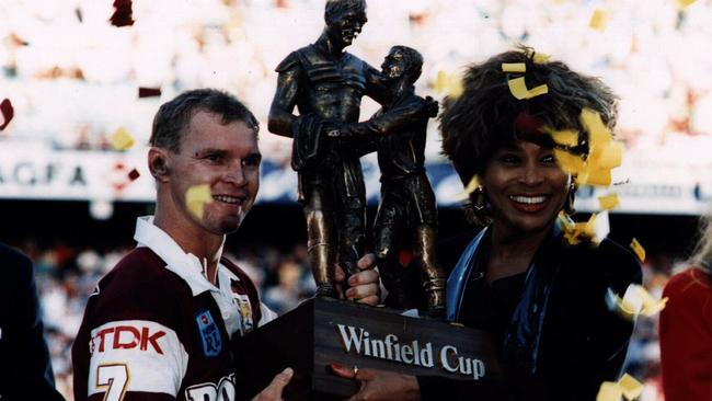 Brisbane Broncos captain Allan Langer &amp; singer Tina Turner holding Winfield Cup trophy in 1993.