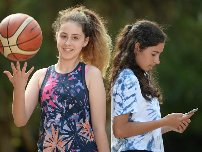 The story is about teenagers and the amount of time they spend on and off screens and playing sport.  Pictured at a park in  Balwyn.  Isabella and Maddie both aged 13. Picture: Lawrence Pinder