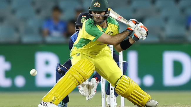 Australia's Glenn Maxwell reverse sweeps during the One-Day International between Australia and India at Manuka Oval, Canberra. Picture. Phil Hillyard