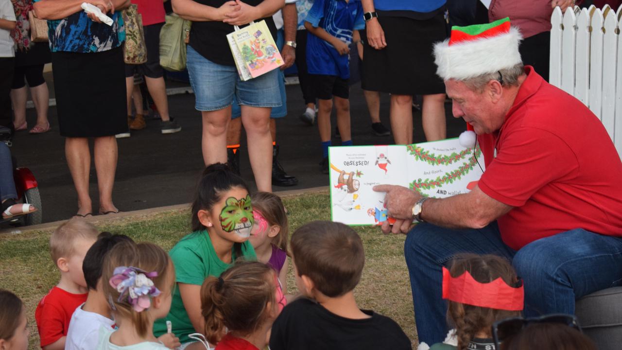 Mayor Paul McVeigh reading a Christmas story to kids at the Christmas tree lighting