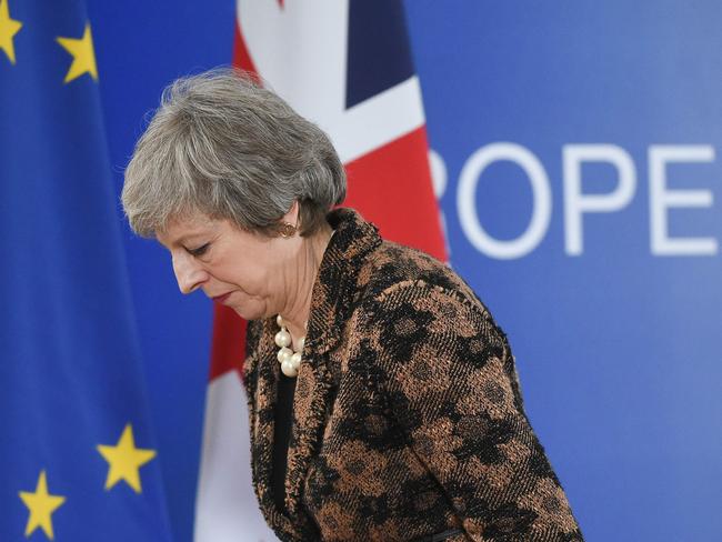 (FILES) In this file photo taken on December 14, 2018 Britain's Prime Minister Theresa May leaves after speaking during a press conference on December 14, 2018 in Brussels during the second day of a European Summit aimed at discussing the Brexit deal, the long-term budget and the single market. - Britain's battle over Brexit resumes on January 7, 2019 when parliament returns from its Christmas break to debate and -- most likely -- defeat Prime Minister Theresa May's unpopular EU divorce deal. (Photo by JOHN THYS / AFP)