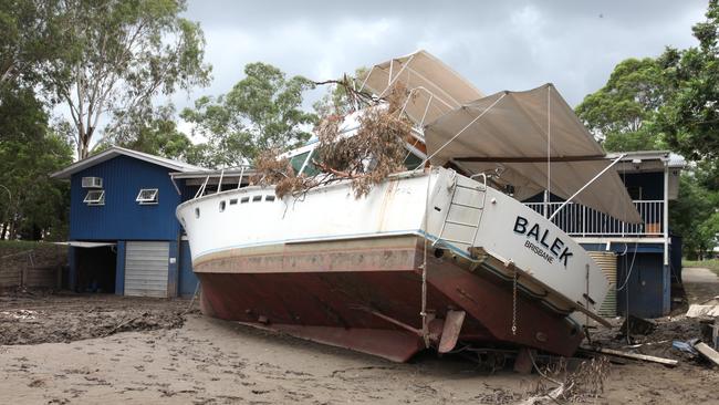 Large boat called Balek at Graceville has washed up quite a distance from the river. Picture: Liam Kidston