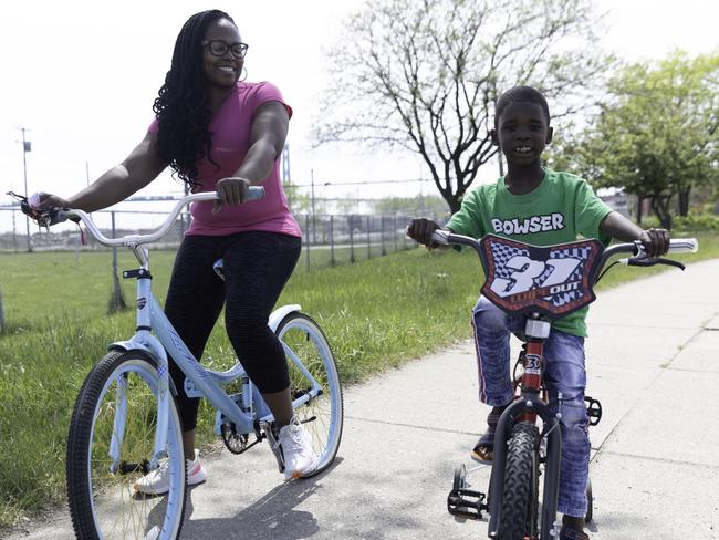 Detroit mother Brenda Garland and son Elijah cycling in a revamped area that was previously a no-go zone. Picture: Angus Mordant