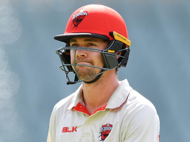 Travis Head of the Redbacks walks from the field after his dismissal during day 4 of the Marsh Sheffield Shield cricket match between the South Australia Redbacks and the Victoria Bushrangers at Adelaide Oval in Adelaide, Monday, March 9, 2020. (AAP Image/David Mariuz) NO ARCHIVING, EDITORIAL USE ONLY, IMAGES TO BE USED FOR NEWS REPORTING PURPOSES ONLY, NO COMMERCIAL USE WHATSOEVER, NO USE IN BOOKS WITHOUT PRIOR WRITTEN CONSENT FROM AAP