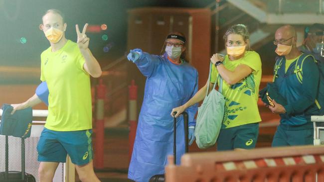 Ariarne Titmus, right, was among the members of the Australian Olympic team to arrive in Darwin on Tuesday. Picture: Glenn Campbell