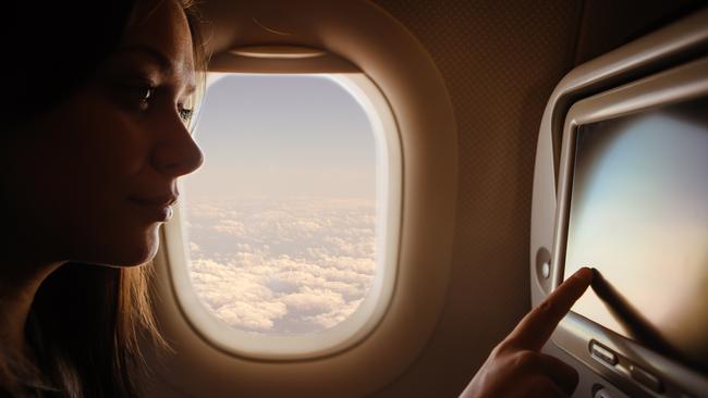 Ensure that you bring plenty of distractions to reduce your anxiety on a flight. Picture: iStock