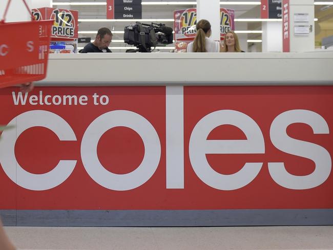 A customer walks past the customer service desk at a Coles supermarket, operated by Wesfarmers Ltd., in the Richmond area of Melbourne, Australia, on Friday, Feb. 10, 2017. Wesfarmers, Australia's largest retailer, is scheduled to report fourth-quarter results on Feb. 15. Photographer: Carla Gottgens/Bloomberg