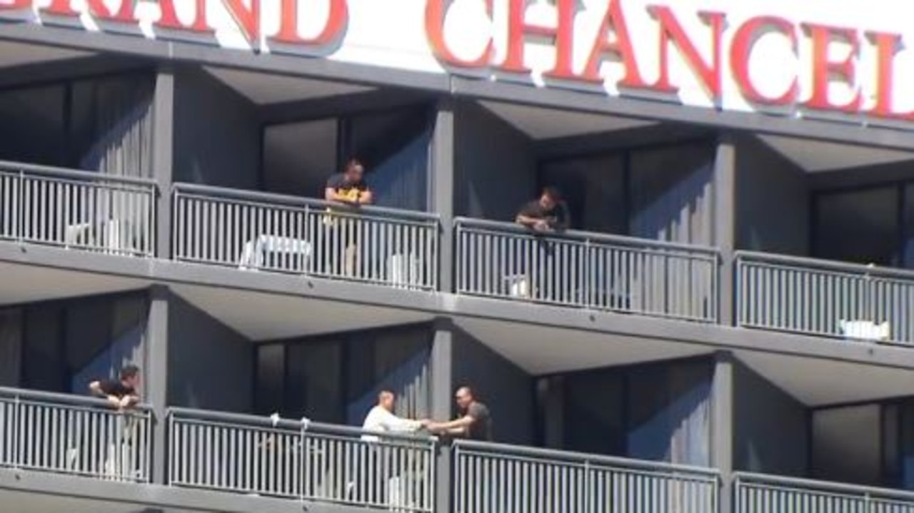 Quarantined visitors have been filmed passing items to one another over balconies at Brisbane's Hotel Grand Chancellor. Picture: Sunrise