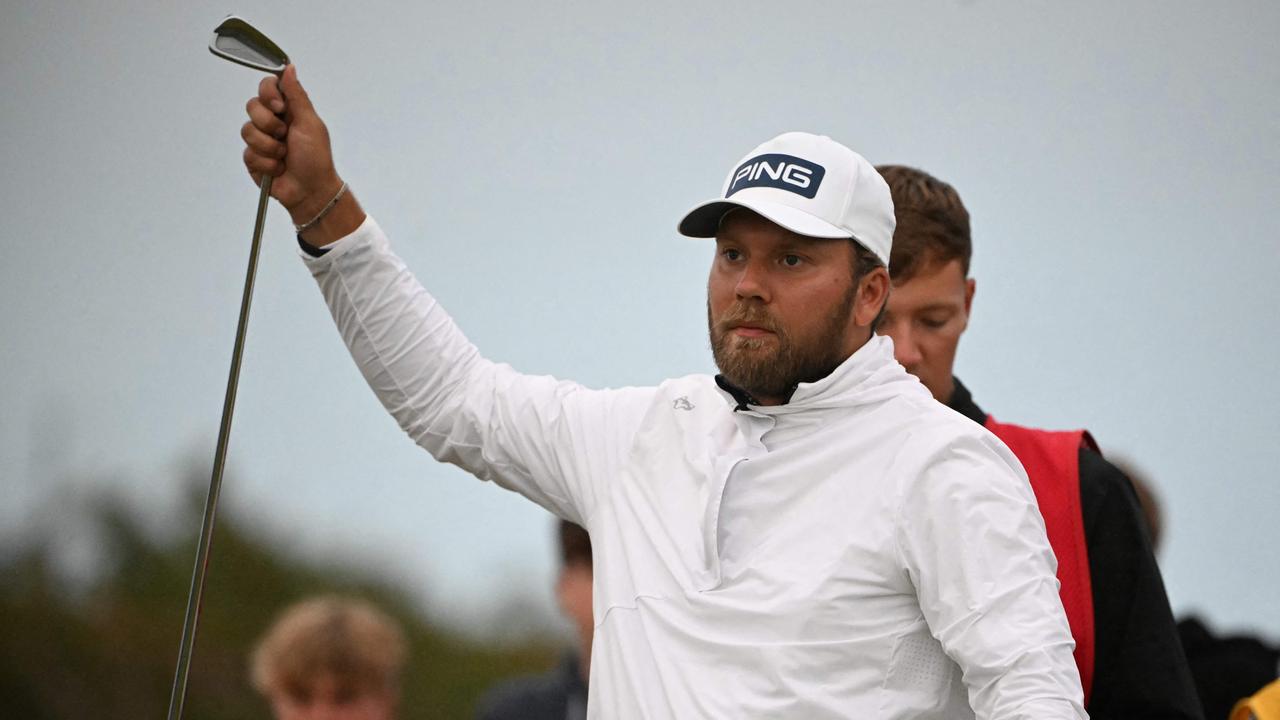 England's Daniel Brown selects his club on the 17th tee on the opening day of the 152nd British Open Golf Championship at Royal Troon on the south west coast of Scotland on July 18, 2024. (Photo by ANDY BUCHANAN / AFP) / RESTRICTED TO EDITORIAL USE