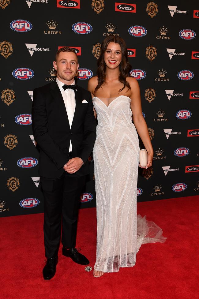 Devon Smith of Essendon and partner Simone Hickman. Picture: AAP