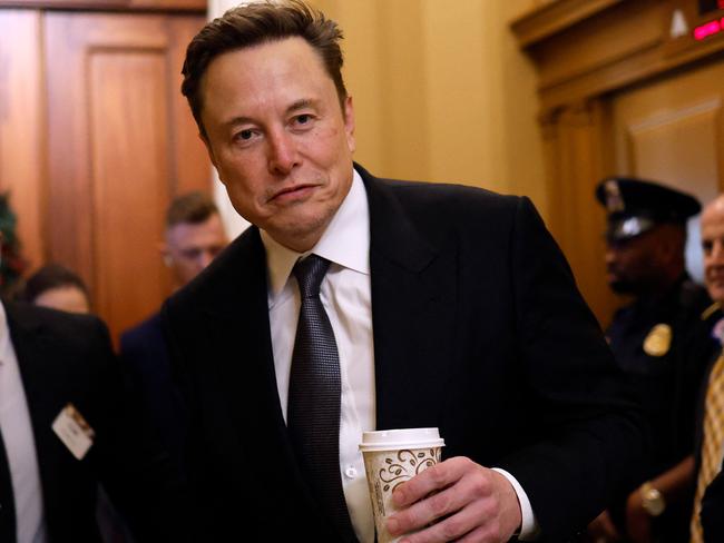 WASHINGTON, DC - DECEMBER 05: Tesla CEO Elon Musk, Co-Chair of the newly announced Department of Government Efficiency (DOGE), arrives on Capitol Hill on December 05, 2024 in Washington, DC. Musk and his Co-Chair, businessman Vivek Ramaswamy are meeting with lawmakers today about DOGE, a planned presidential advisory commission with the goal of cutting government spending and increasing efficiency in the federal workforce.   Anna Moneymaker/Getty Images/AFP (Photo by Anna Moneymaker / GETTY IMAGES NORTH AMERICA / Getty Images via AFP)