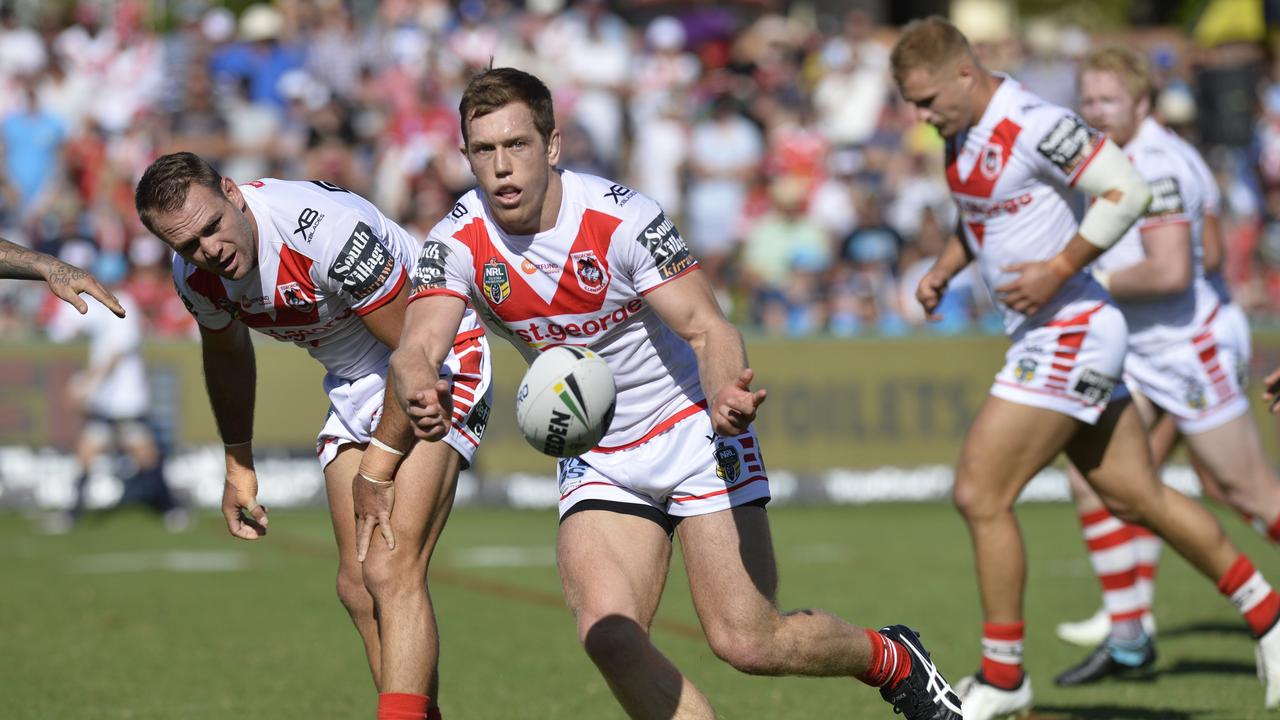 Dragons player Cameron McInnes fires off a pass during the round 3 NRL game played at Clive Berghofer Stadium in 2018.