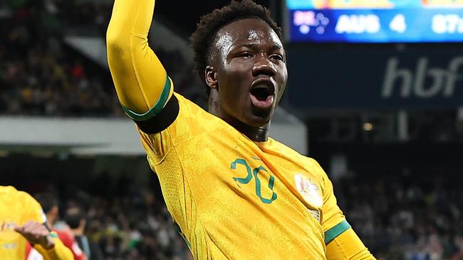 PERTH, AUSTRALIA - JUNE 11: Nestory Irankunda of Australia celebrates a goal from a penalty kick during the Second Round FIFA World Cup 2026 Qualifier match between Australia Socceroos and Palestine at HBF Park on June 11, 2024 in Perth, Australia. (Photo by Paul Kane/Getty Images)