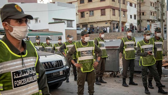 Members of Morocco's Interior Ministry Auxiliary Forces patrol a neighbourhood to enforce the reimposed lockdown due to a spike in coronavirus cases, in the capital Rabat. Picture: AFP